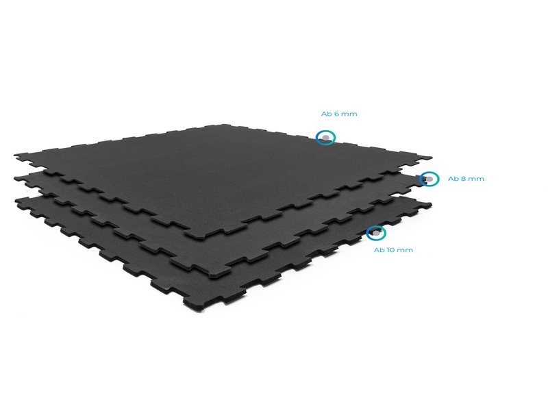 A close-up of a detailed architectural blueprint with a section dedicated to gym flooring specifications.